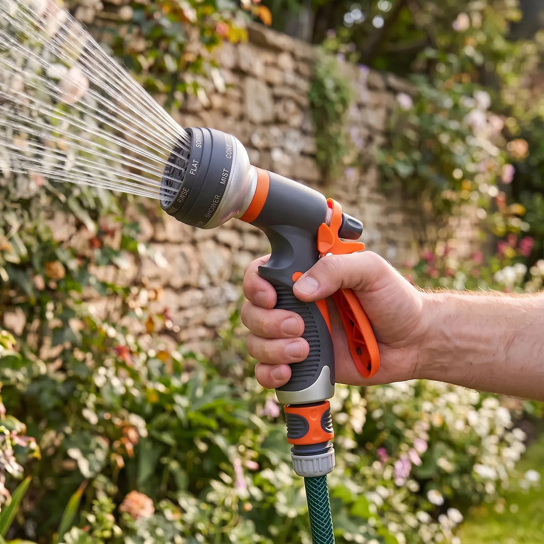 Adjustable garden hose nozzle for effortless watering. Features multi-pattern spray and ergonomic grip for lawn care.