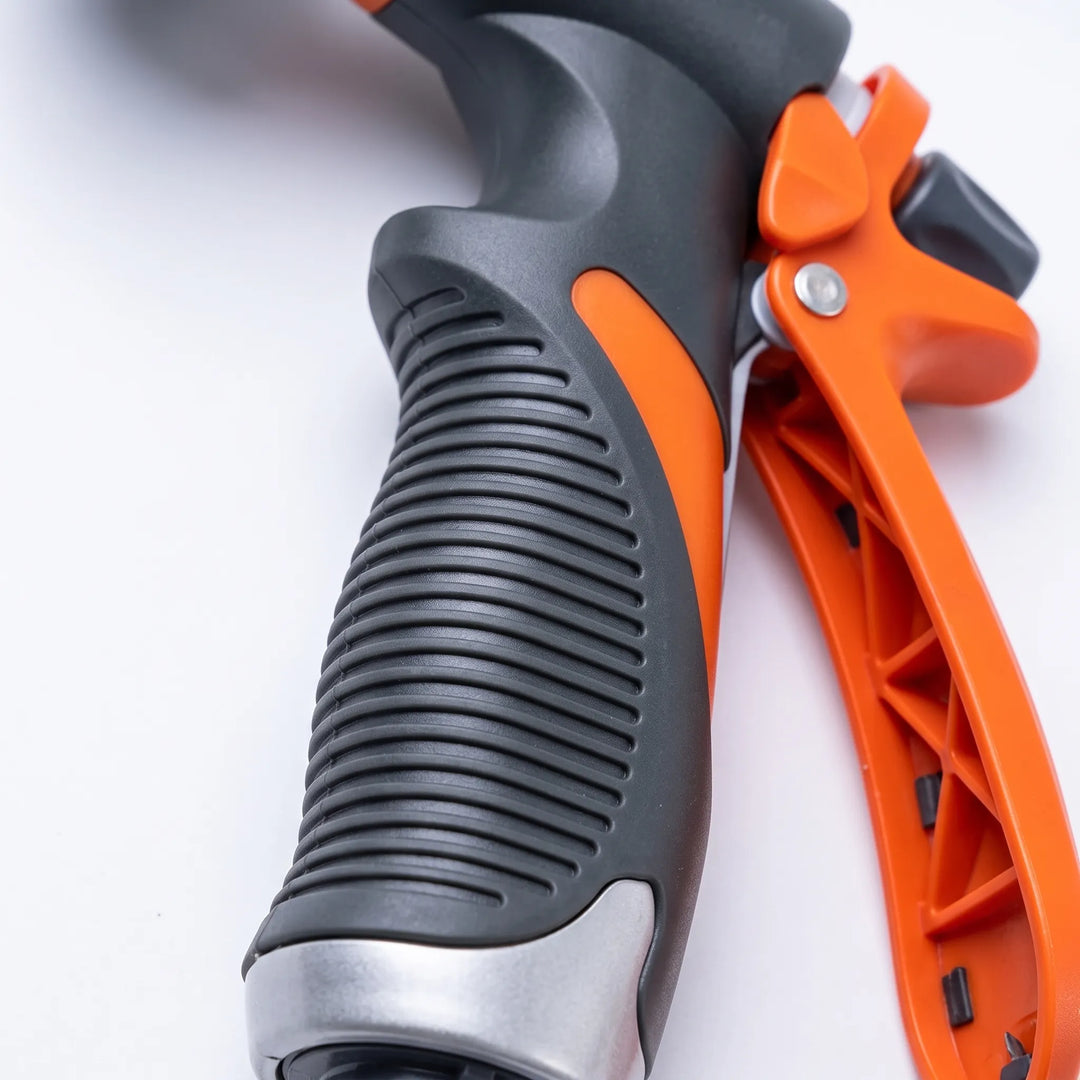 Ergonomic grip garden hose nozzle with adjustable spray for comfortable lawn care, watering, and outdoor cleaning.