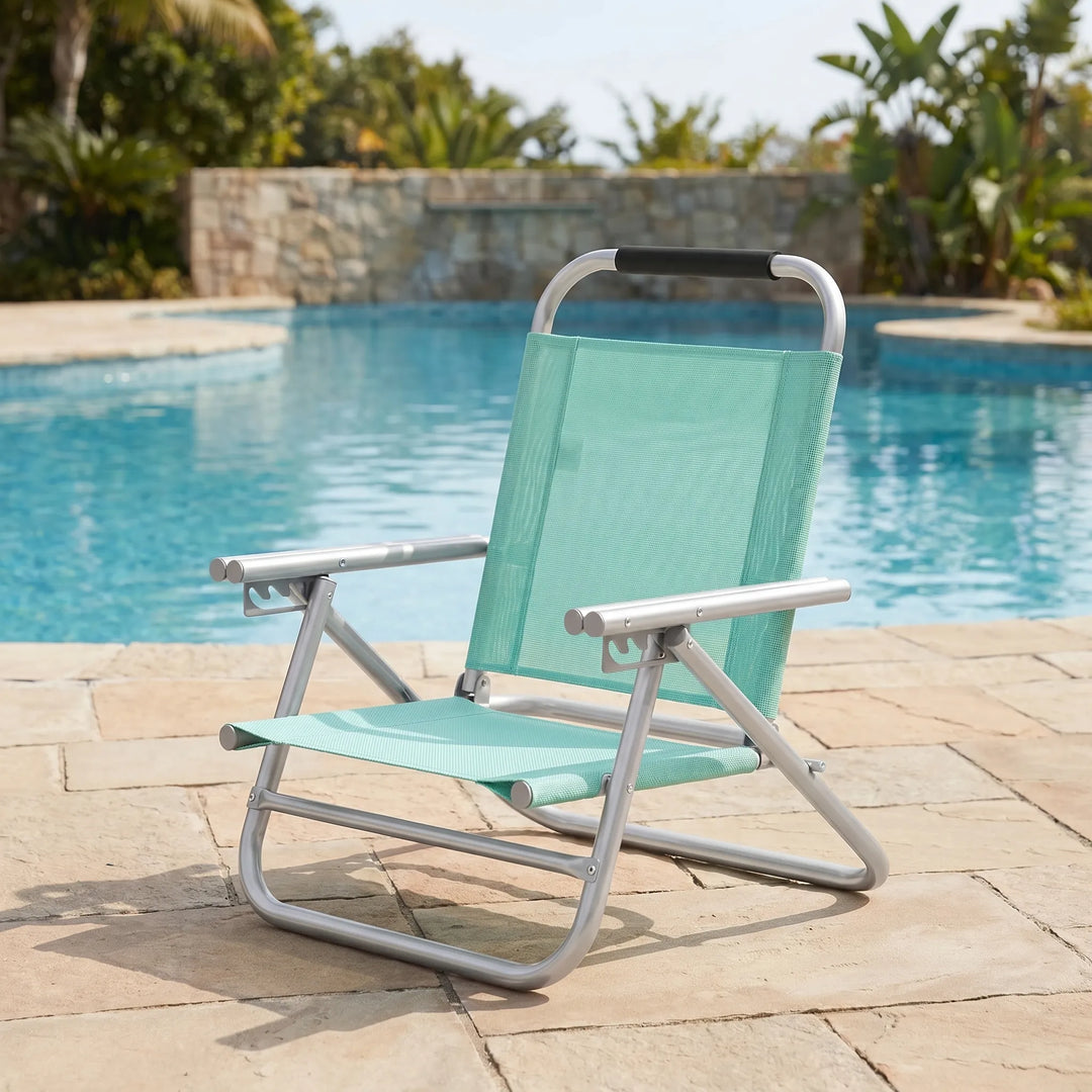 Adjustable portable beach chair, lightweight and foldable for easy transport. Perfect for summer outdoor relaxation.