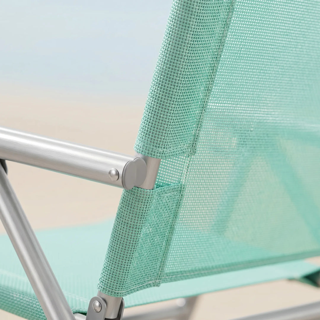 Comfortable portable beach chair for ultimate outdoor relaxation. Features an adjustable recline for sunbathing.