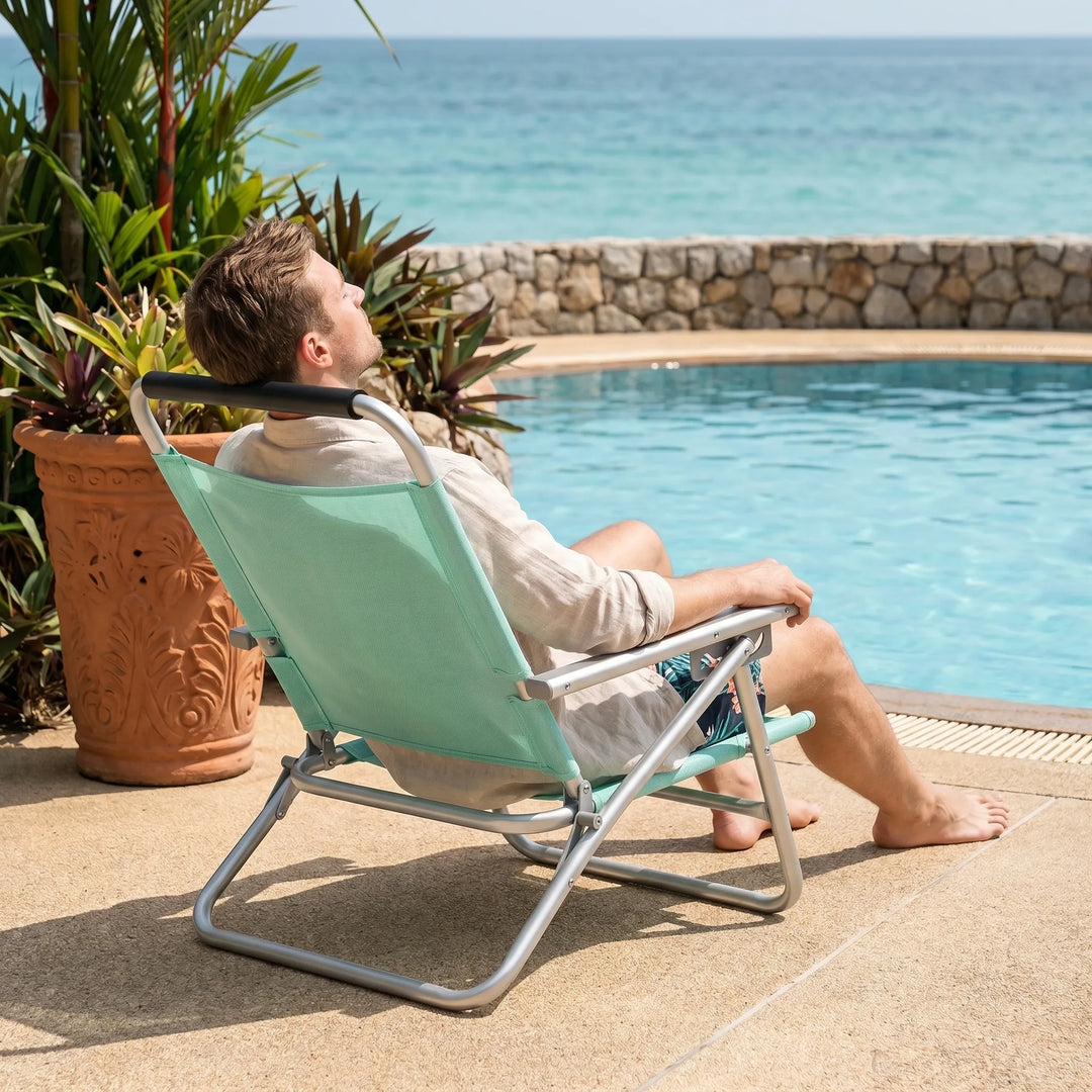 Versatile adjustable beach chair, foldable and lightweight. Great for outdoor seating on the beach, patio, or camping.