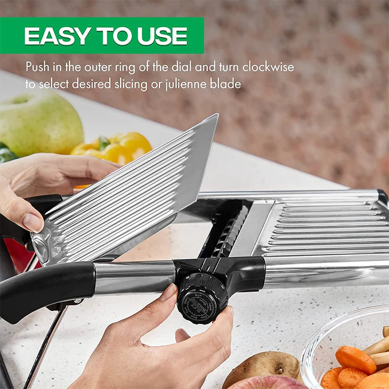 Chef using an adjustable stainless steel mandoline slicer to perfectly slice cucumbers for salads.