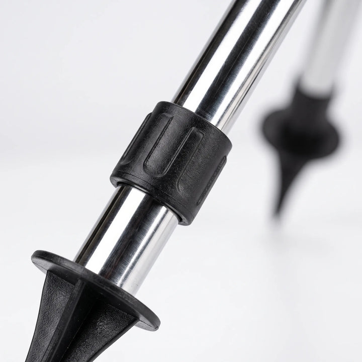 Tall adjustable garden sprinkler on a tripod for wide-area lawn watering and yard care irrigation.