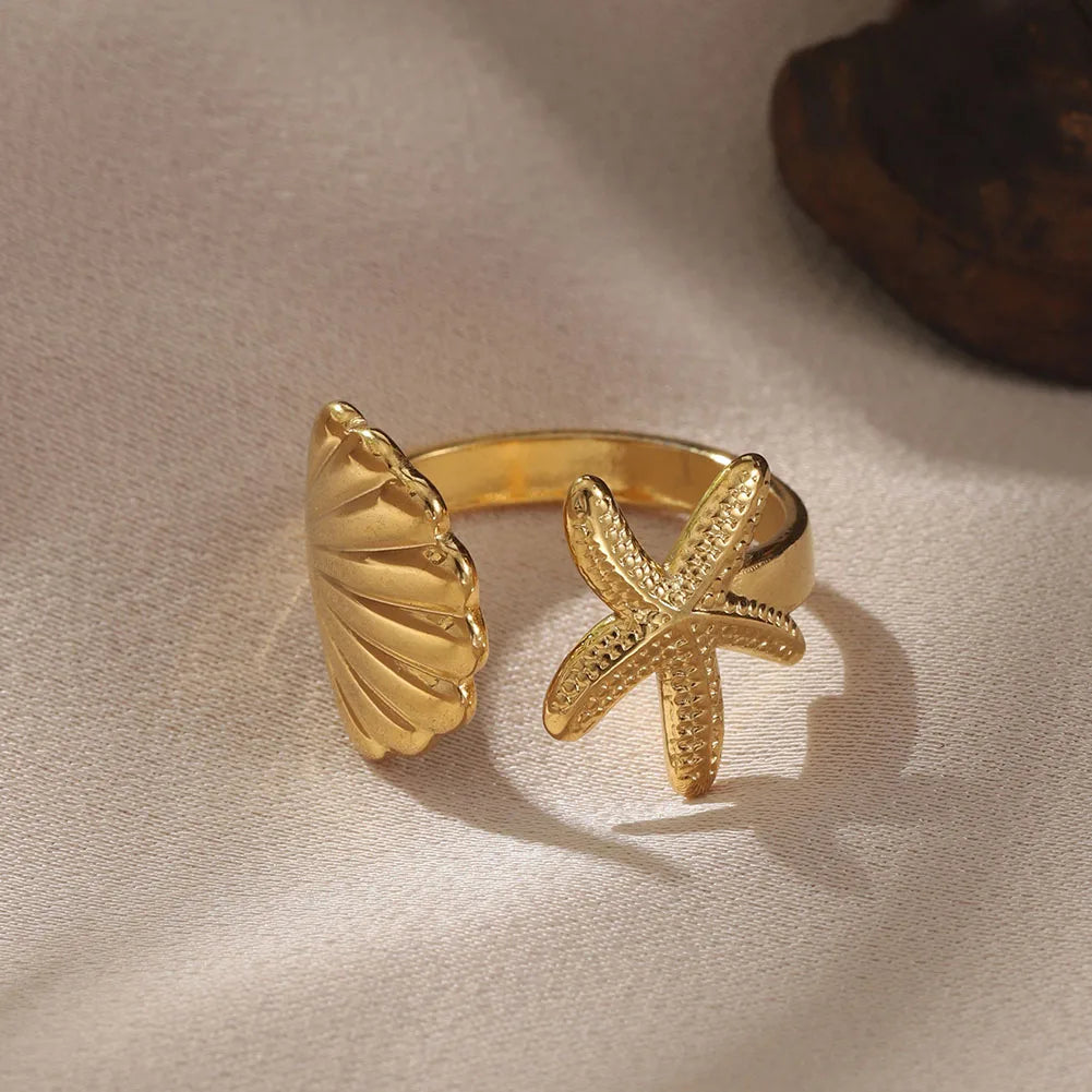 Close-up of the stainless steel women's seahorse ring set with intricate ocean-themed enamel details.