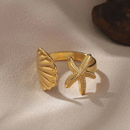 Close-up of the stainless steel women's seahorse ring set with intricate ocean-themed enamel details.