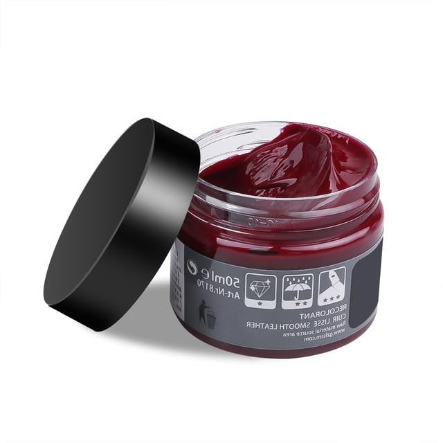 Hand applying advanced leather repair gel to a damaged furniture piece for a professional finish.