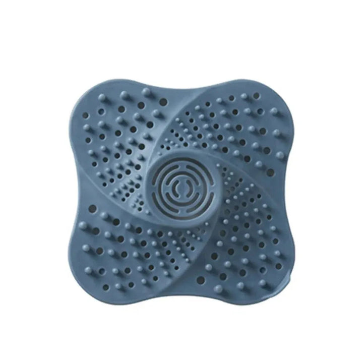 Efficient spiral hair trap for shower drains. Reusable TPR drain protector prevents clogs & maintains flow.