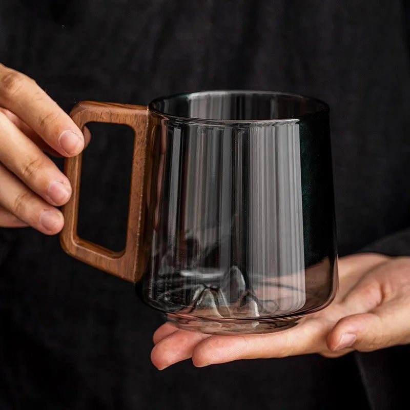 Unique glass mug with stunning 3D mountain base and smooth wooden handle, a perfect artisan gift for coffee lovers.