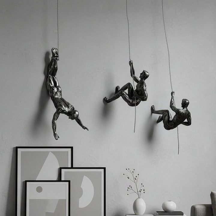 Artistic climber figure wall sculpture, perfect for modern home decor & office.