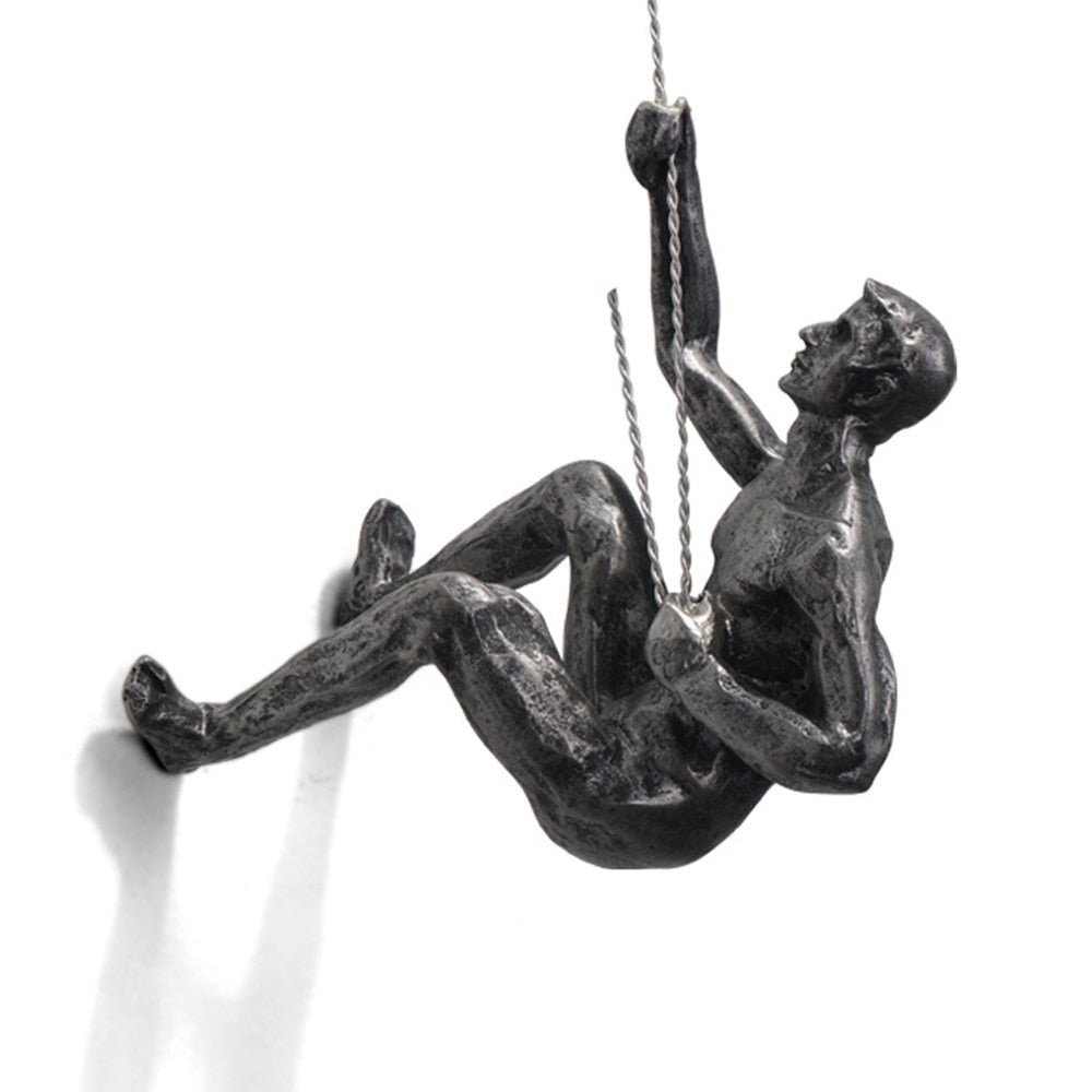 Office decoration: Inspirational climber figure wall sculpture, dynamic art piece.
