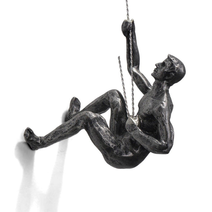 Office decoration: Inspirational climber figure wall sculpture, dynamic art piece.