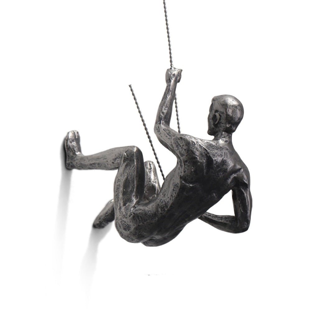 Unique wall art: Artistic climber figure sculpture, handmade for modern interiors.