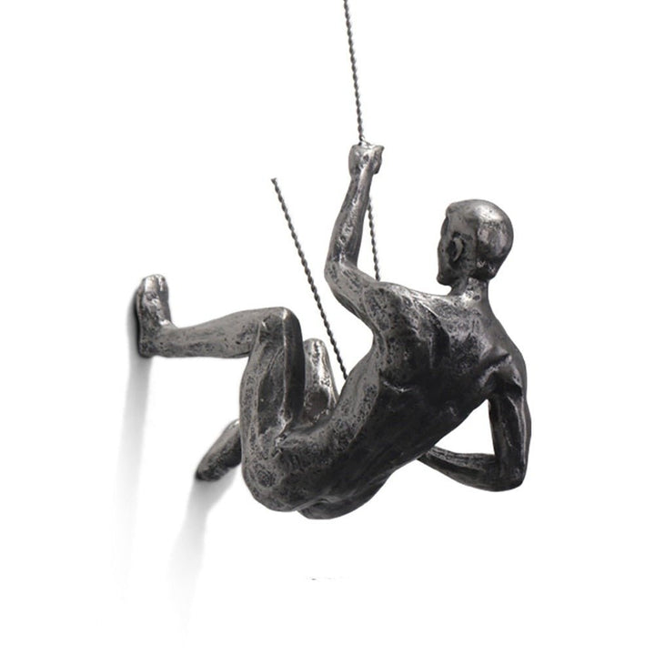 Unique wall art: Artistic climber figure sculpture, handmade for modern interiors.