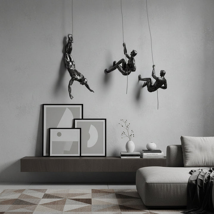Contemporary wall sculpture: Abstract climbing figure, adds dynamic flair to decor.