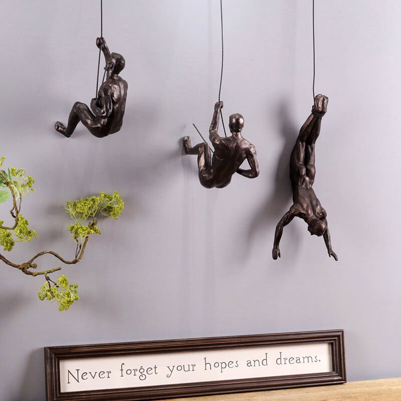 Inspirational abstract climber figure, modern wall sculpture for interior design.