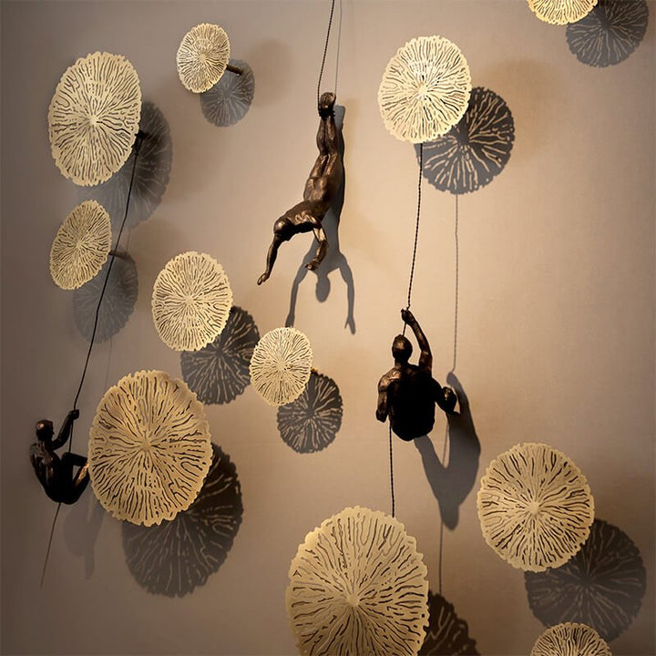 Handmade wall figure sculpture, abstract climber design for contemporary decor.