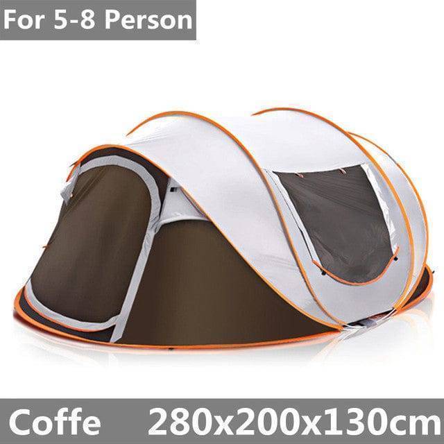 Group of people gathered around a large automatic family camping tent, enjoying the outdoor gear