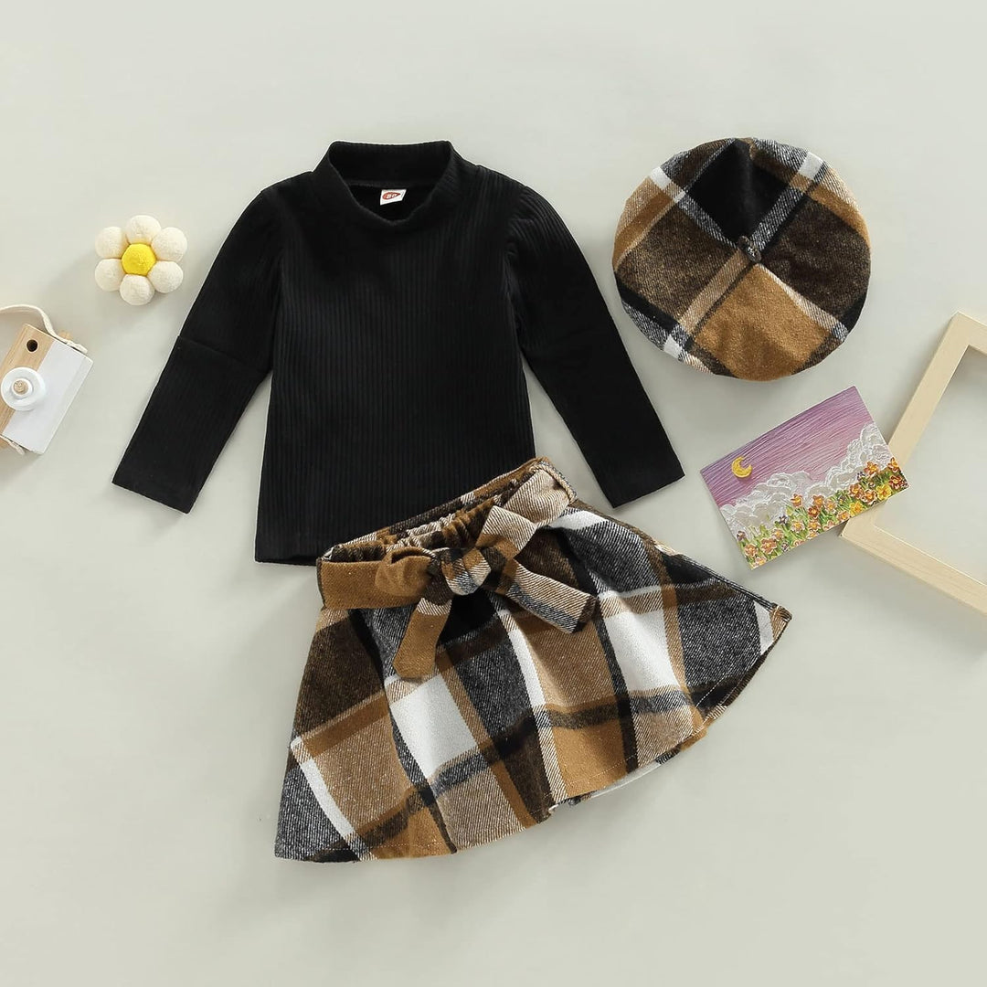 Sweet baby girl's winter fashion: knitted turtleneck and a cute dress.
