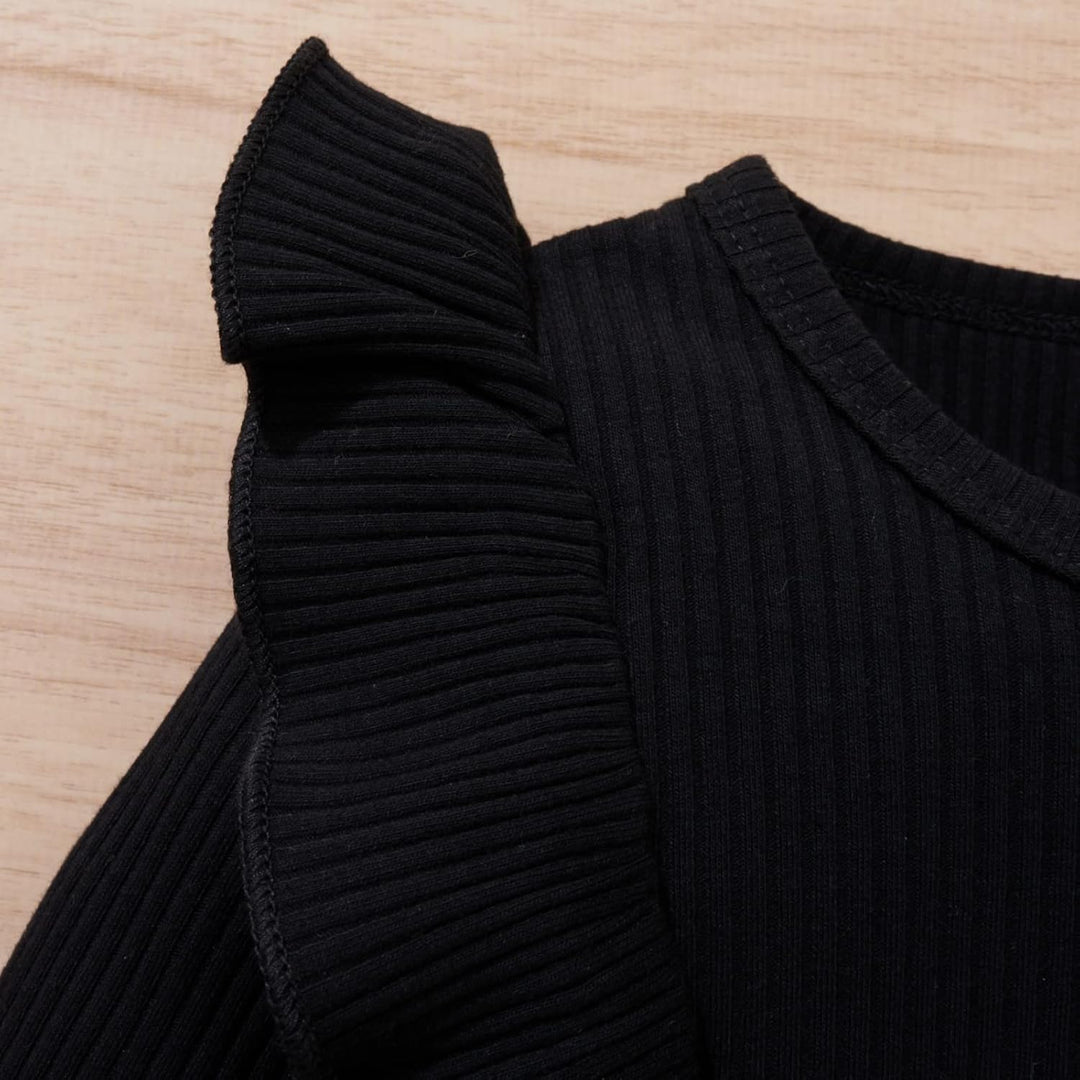 Baby girl's delightful knitted turtleneck and dress set, perfect for warmth.