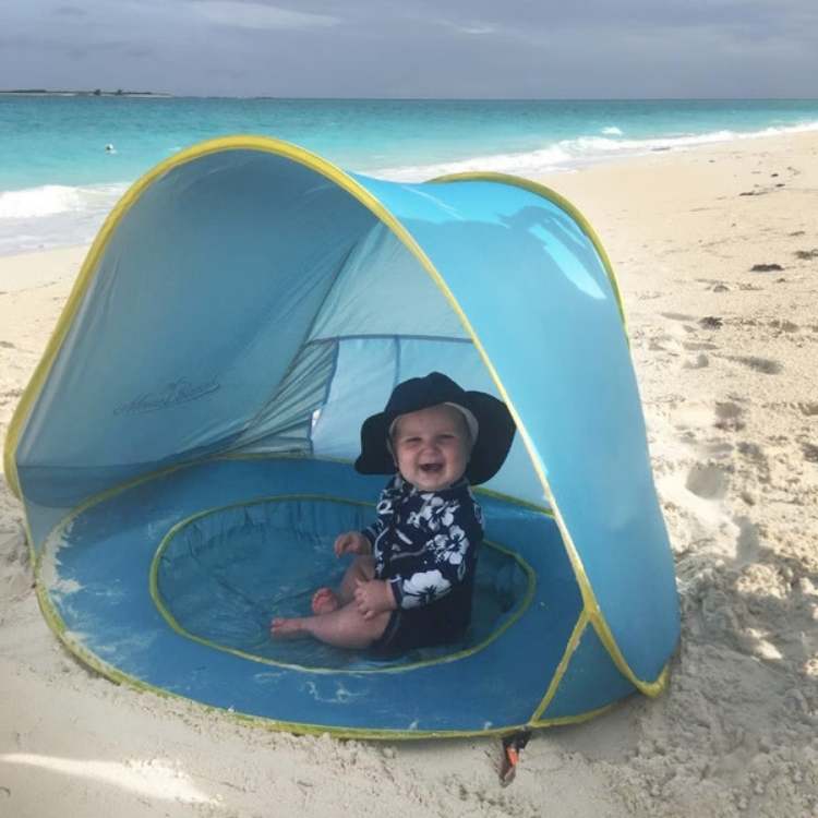 Baby pop-up beach tent with built-in pool, offering UV protection for outdoor play, travel-friendly sun shade