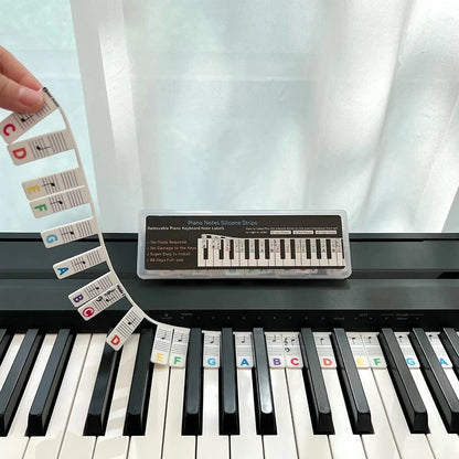 Silicone piano note guide strips for beginners. Removable keyboard accessory for easy music education & practice.