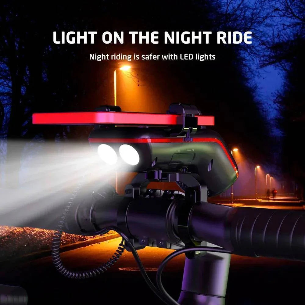 Cycling gear showing a bike light, integrated Bluetooth speaker, and phone mount for bicycles