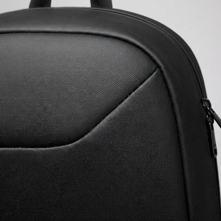 Secure black laptop backpack for daily commute & college. Anti-theft design protects electronics & valuables on the go.