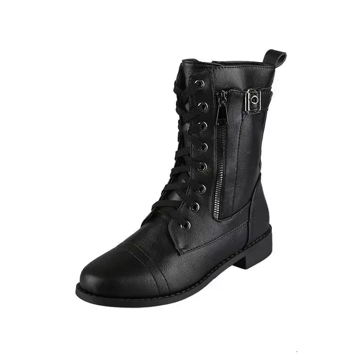 Black edgy women's mid-calf boots with buckles, lace-up, and zipper for a rebel fashion footwear statement.