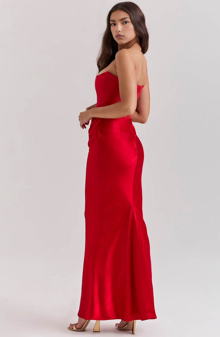 Stylish strapless maxi evening gown with corset detail, ideal for special occasions.