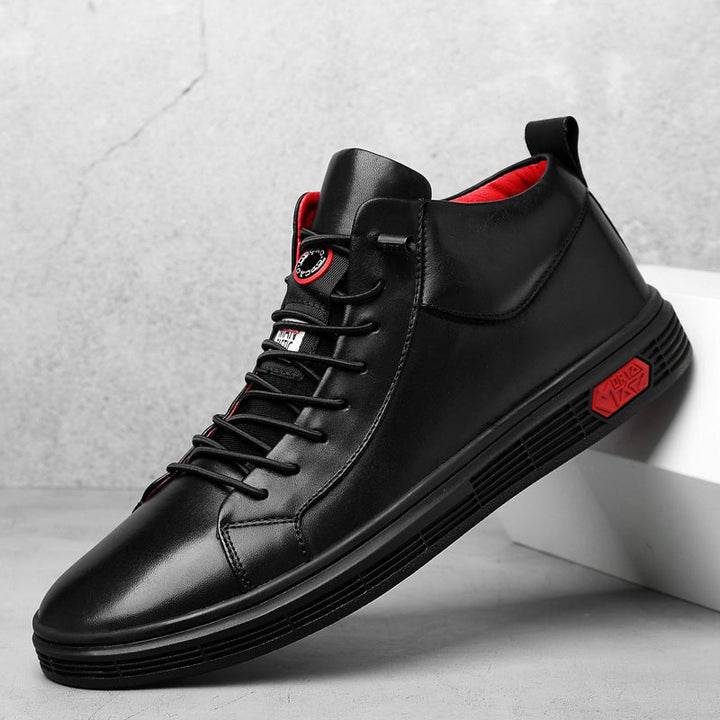 Black high-top fashion sneakers for men with bold red accents.