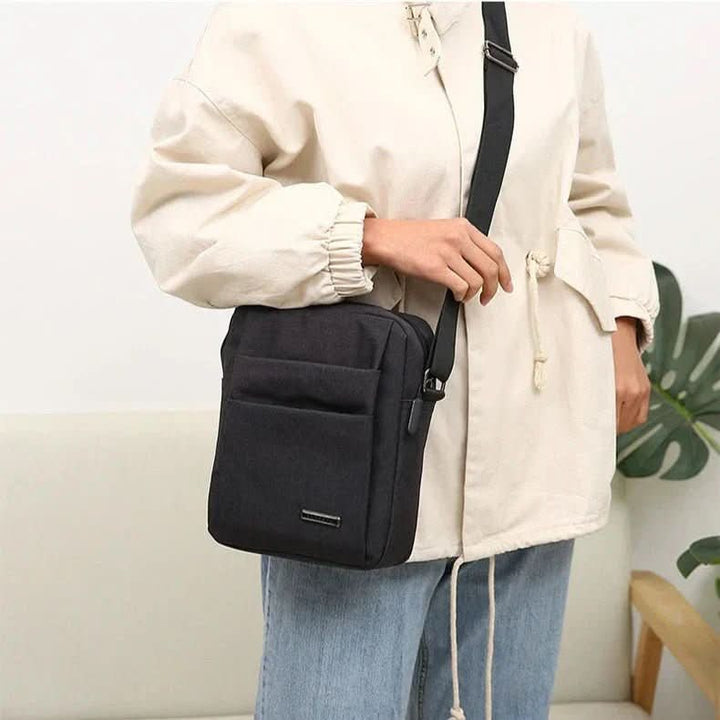 Comfortable gray men's anti-theft cross-body bag, waterproof for secure daily carry.