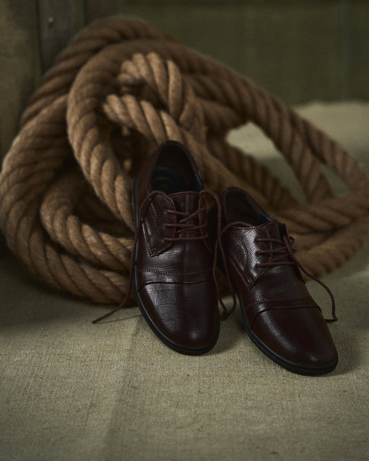 Brown men's formal dress shoes, versatile and comfortable for business and special events.
