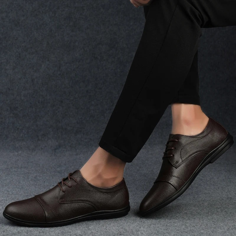 Comfortable black men's dress shoes with a modern design for business casual style.