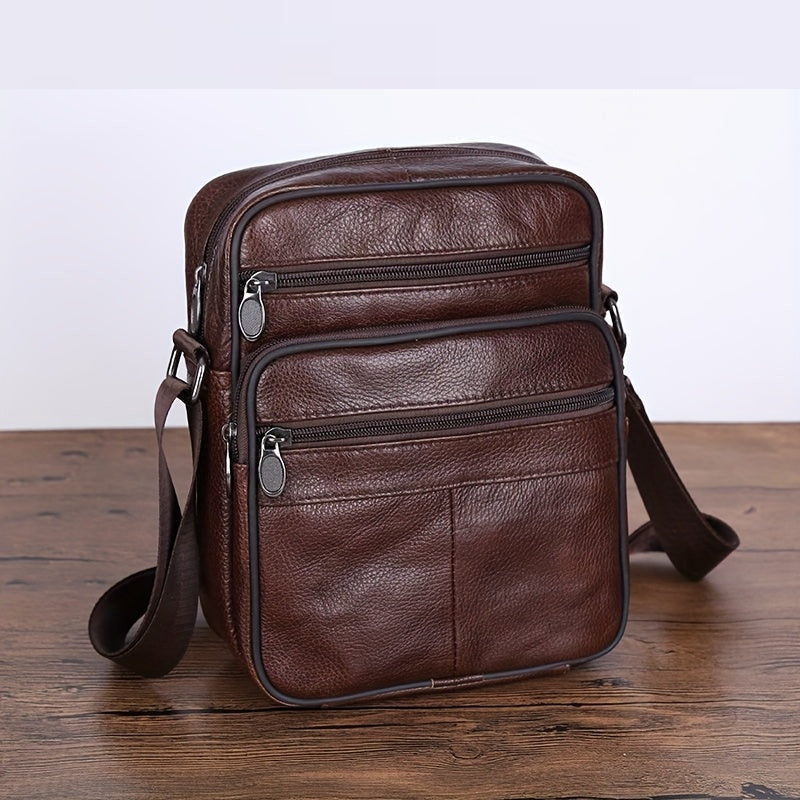 Modern black men's cross-body bag. Spacious design for daily essentials. Adjustable & comfortable strap.