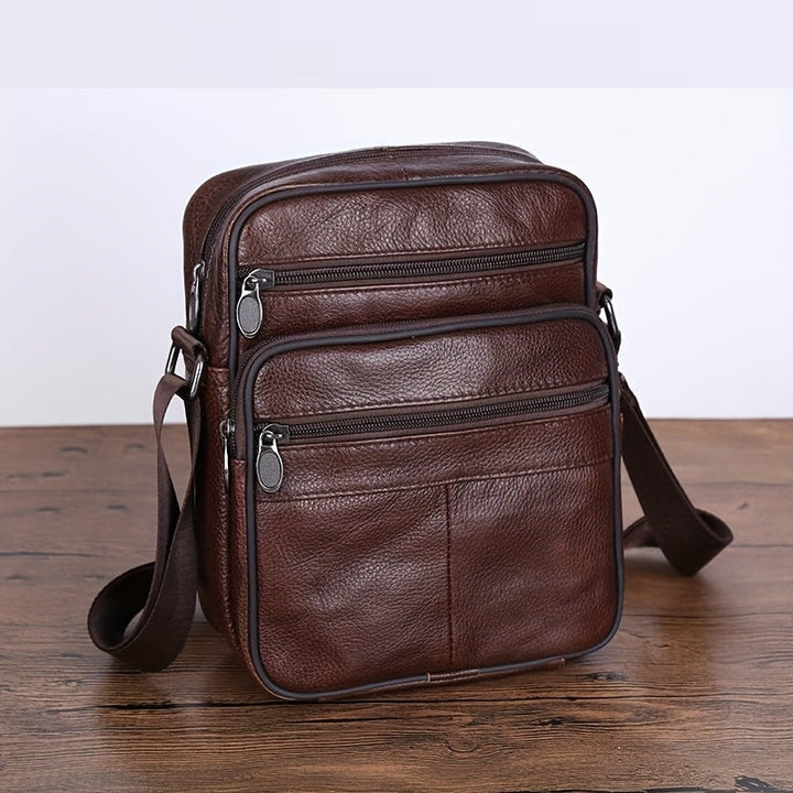 Modern black men's cross-body bag. Spacious design for daily essentials. Adjustable & comfortable strap.