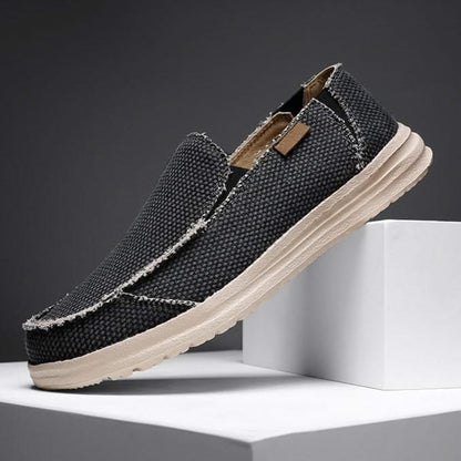 Grey men's comfort slip-on loafers. Versatile, lightweight footwear perfect for casual walking.
