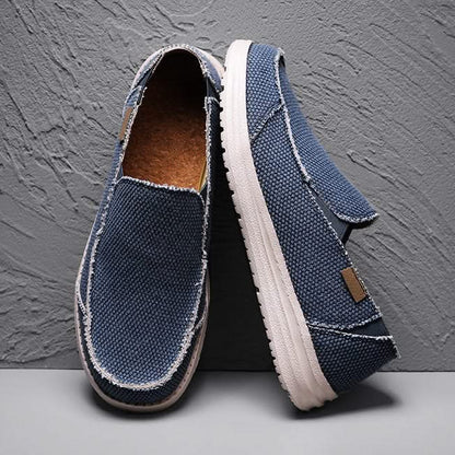 Durable grey men's slip-on loafers. Lightweight, comfortable everyday footwear for casual walking.
