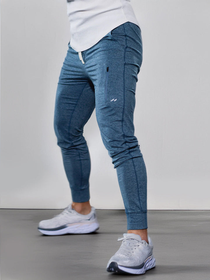 Black men's performance stretch joggers, tapered fit, ideal for active lifestyles & gym.