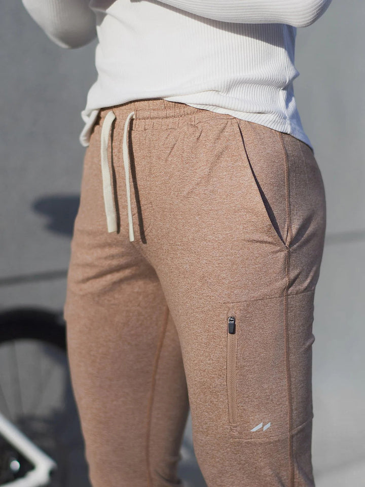 Isolated black men's performance stretch joggers on a white background.