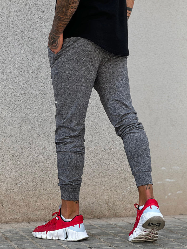 Men's athletic joggers, navy, demonstrating flexibility for various sports.