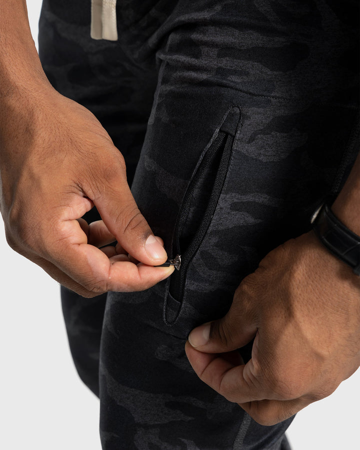 Men's performance stretch joggers, grey, walking dog in park, active daily life.