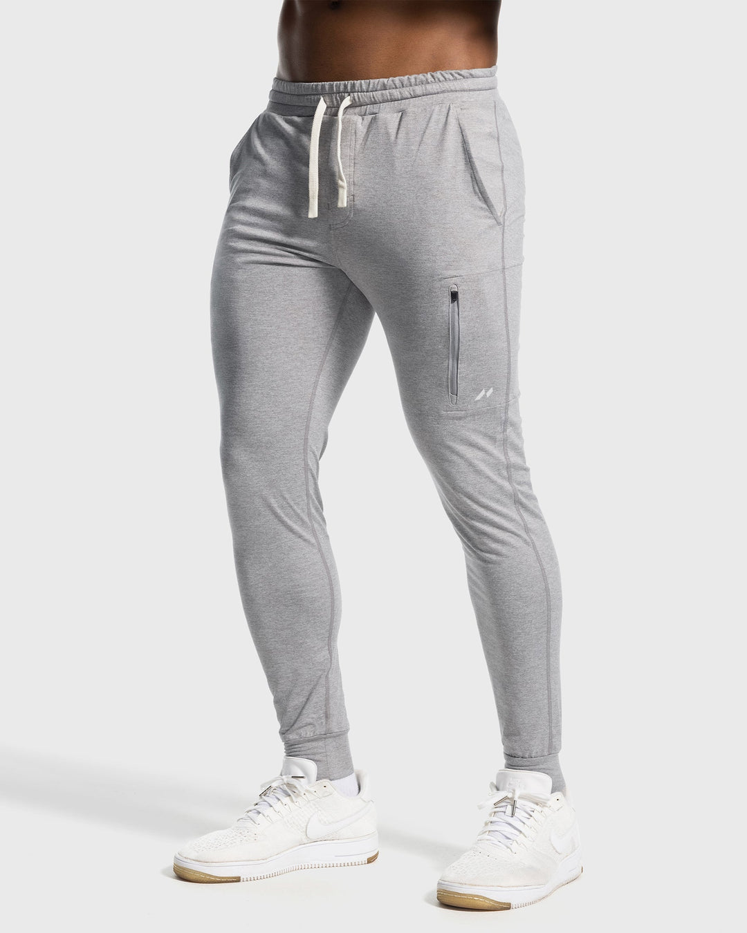 Comfortable men's stretch joggers for yoga & stretching, flexible activewear.