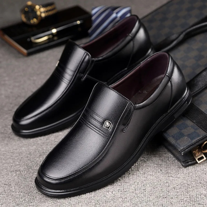 Classic black men's slip-on loafers, elegant dress shoes perfect for formal, business, or casual wear.