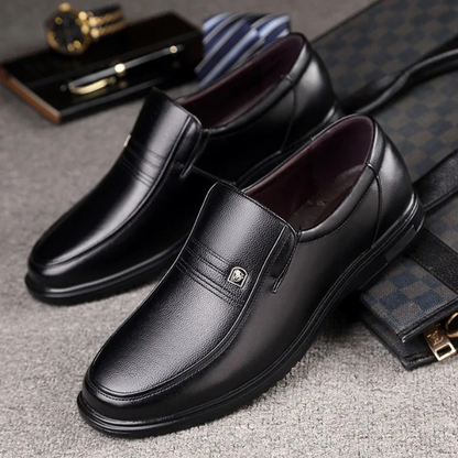 Classic black men's slip-on loafers, elegant dress shoes perfect for formal, business, or casual wear.