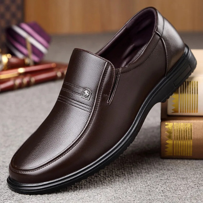 Refined men's dark brown leather loafers, classic slip-on dress shoes for sophisticated business looks.