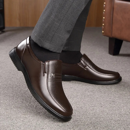 Men's comfortable black loafer dress shoes, classic slip-on style for formal business and elegant wear.
