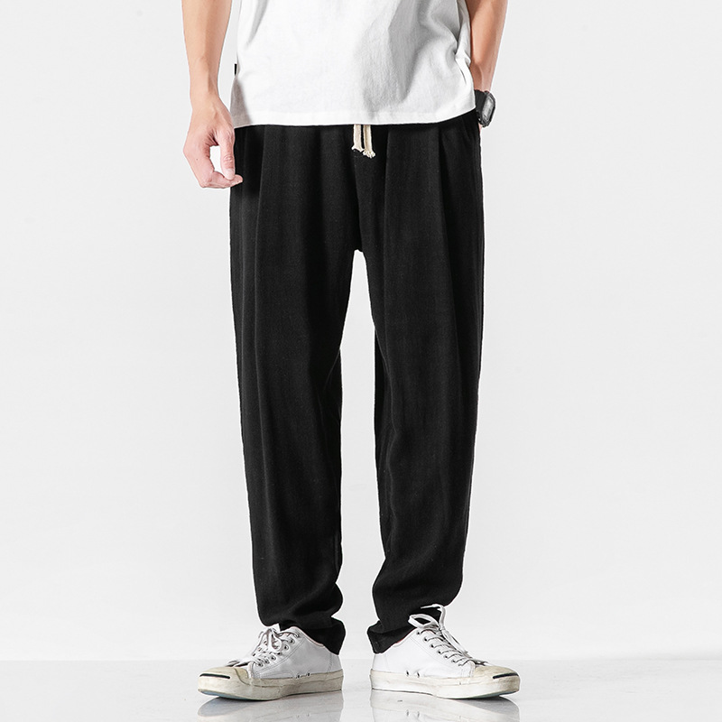 Black men's relaxed fit casual pants with drawstring for everyday comfort and effortless style.