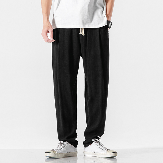 Black men's relaxed fit casual pants with drawstring for everyday comfort and effortless style.