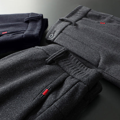 Men's black slim fit stretch pants, designed for a tailored, modern look.