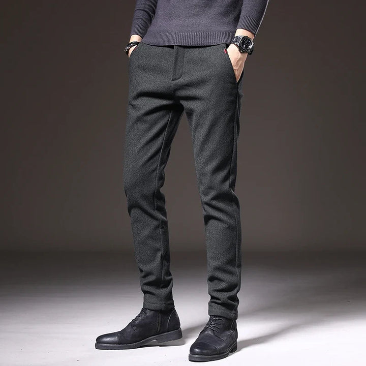 Gray tailored slim fit stretch pants, wrinkle resistant, ideal for office.